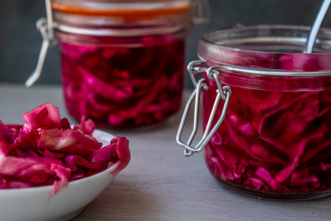 Colourful fermented foods in glass jars